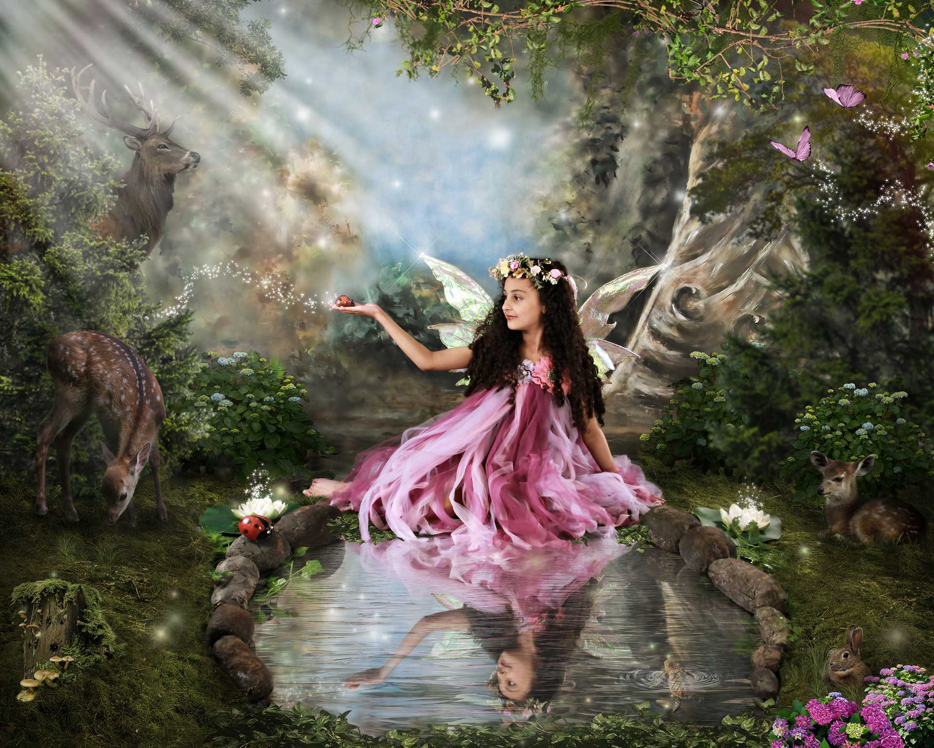 Girl with fairy wings by a pond in a magical forest